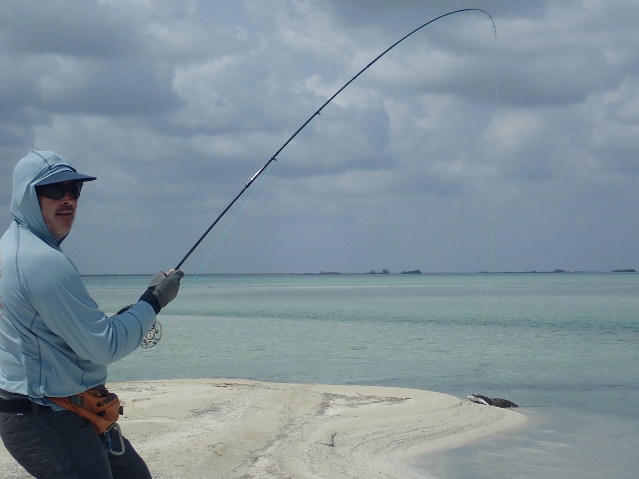 Tim Hennessey reeling in a bonefish and an alligator!