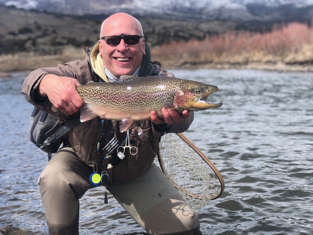 Don Girard with a Nice Rainbow, caught on a Rainbow Warrior